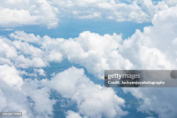 aerial shot of blue sky with clouds - on top of clouds stock pictures, royalty-free photos & images