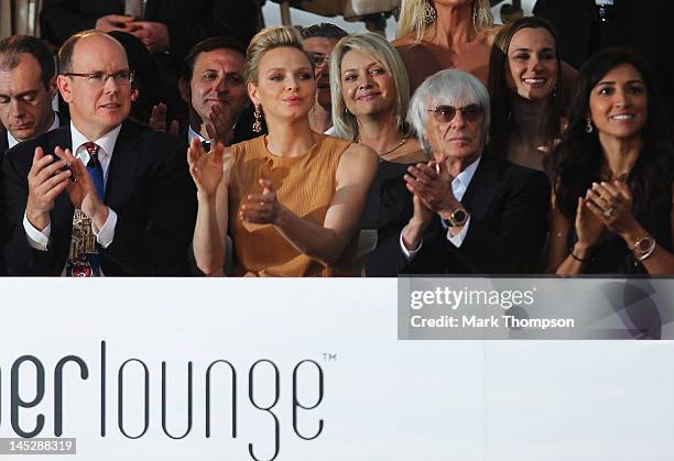 Prince Albert II of Monaco and Princess Charlene of Monaco and F1 Supremo Bernie Ecclestone and his fiancee Fabiana Flosi attend the Amber Fashion...