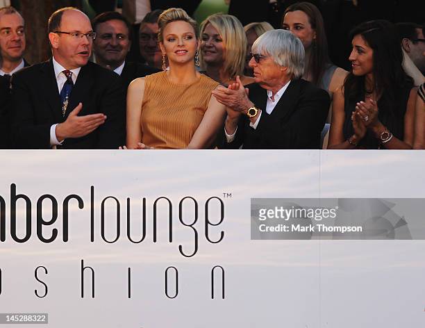 Prince Albert II of Monaco and Princess Charlene of Monaco and F1 Supremo Bernie Ecclestone and his fiancee Fabiana Flosi attend the Amber Fashion...
