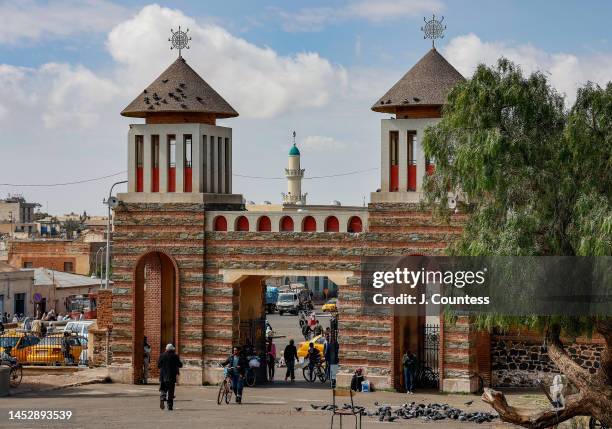 The minaret of the Khulafa al-Rashidun Mosque can be seen behind the main entrances to St. Mary's Orthodox Church in the city center on December 27,...