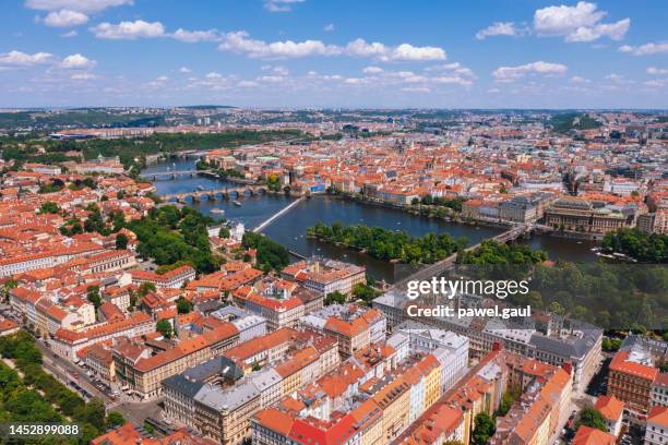 aerial view of vltava river charles bridge and shooters' island in czech republic - prague river stock pictures, royalty-free photos & images