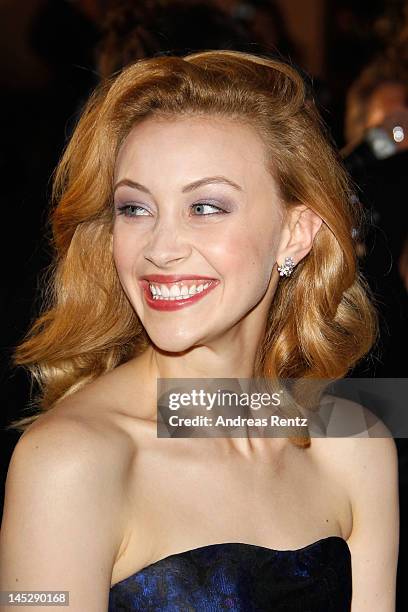 Actress Sarah Gadon departs the "Cosmopolis" premiere during the 65th Annual Cannes Film Festival at Palais des Festivals on May 25, 2012 in Cannes,...