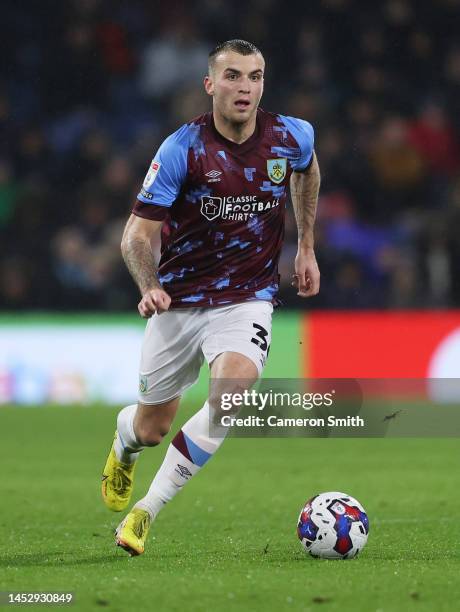 Jordan Beyer of Burnley runs with the ball during the Sky Bet Championship between Burnley and Birmingham City at Turf Moor on December 27, 2022 in...