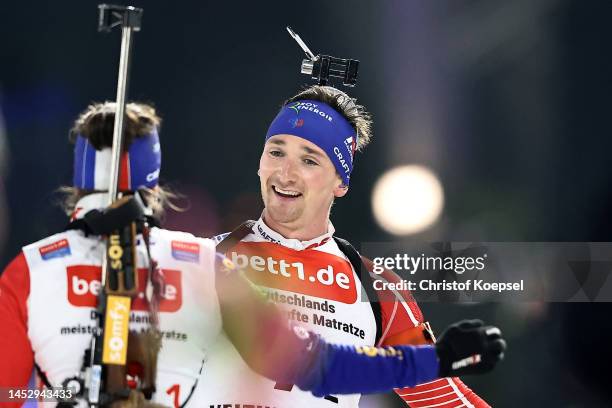 Julia Simon of France and Fabien Claude of France celebrate winning the Bett1 Biathlon Team Challenge at Veltins Arena on December 28, 2022 in...