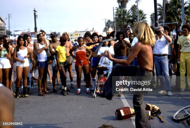 Street performer juggles flaming torches in Muscle Beach, the birthplace of the fitness and bodybuilding craze, in September, 1979 in Venice,...