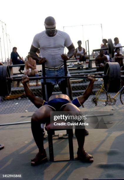 Weightlifters and onlookers in Muscle Beach, the birthplace of the fitness and bodybuilding craze, in September, 1979 in Venice, California.