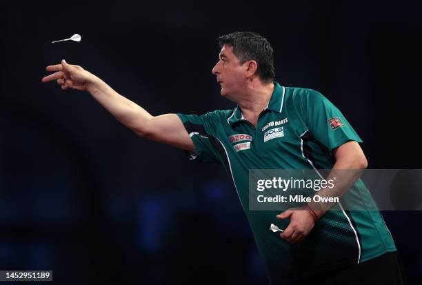 Mensur Suljovic of Serbia competes during his Third Round match against Michael van Gerwen of Netherlands during Day Nine of The Cazoo World Darts...