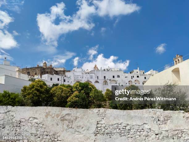 view over the city of ostuni from a distance - piazze italiane foto e immagini stock