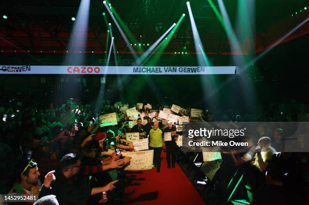 Michael van Gerwen of Netherlands walks out during his Third Round match against Mensur Suljovic of Serbia during Day Nine of The Cazoo World Darts...