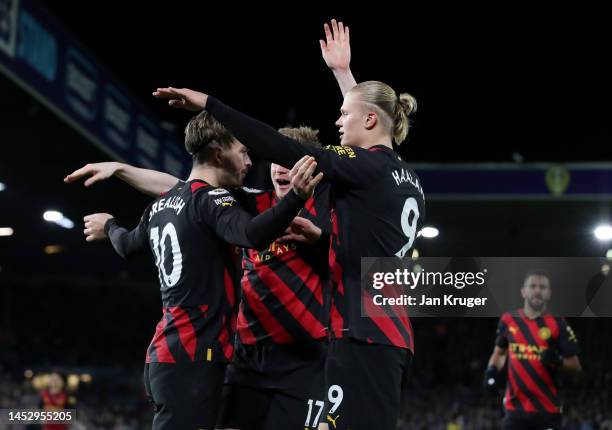 Erling Haaland of Manchester City celebrates with Jack Grealish and Kevin De Bruyne after scoring the team's second goal during the Premier League...