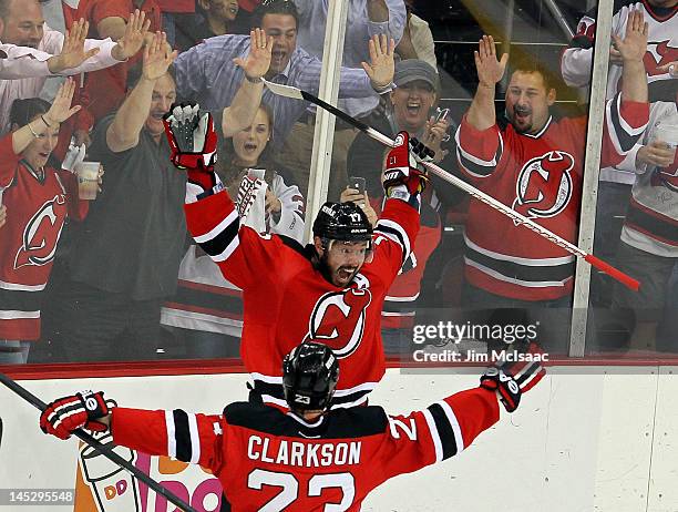 Ilya Kovalchuk of the New Jersey Devils celebrates with teammate David Clarkson after scoring a goal in the first period against the New York Rangers...