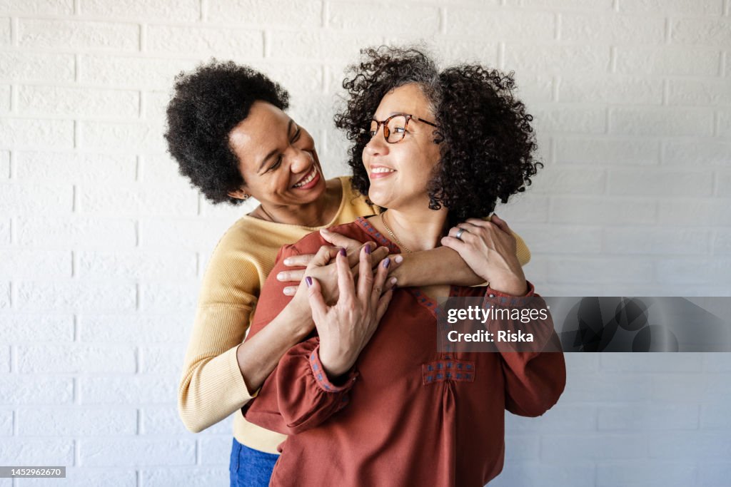 Portrait of two lesbian women hugging