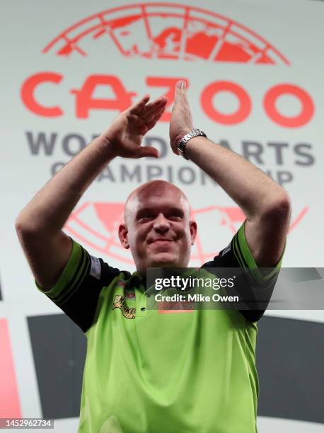 Michael van Gerwen of Netherlands celebrates the win during his Third Round match against Mensur Suljovic of Serbia during Day Nine of The Cazoo...