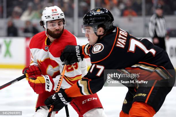 Frank Vatrano of the Anaheim Ducks pushes Dillon Dube of the Calgary Flames during the second period of a game at Honda Center on December 23, 2022...