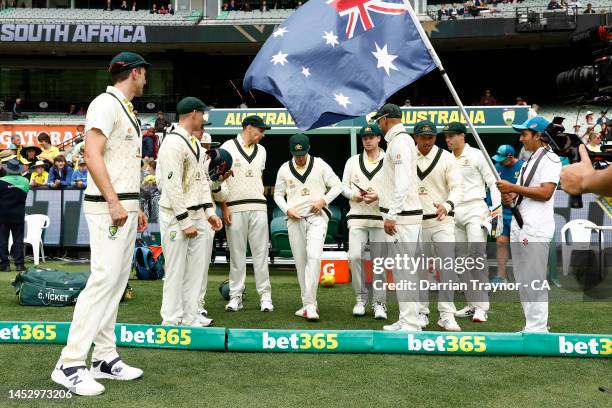 The Australian team walk onto the field before day four of the Second Test match in the series between Australia and South Africa at Melbourne...
