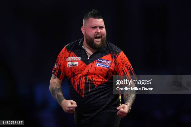 Michael Smith of England celebrates during his Third Round match against Martin Schindler of Germany during Day Nine of The Cazoo World Darts...