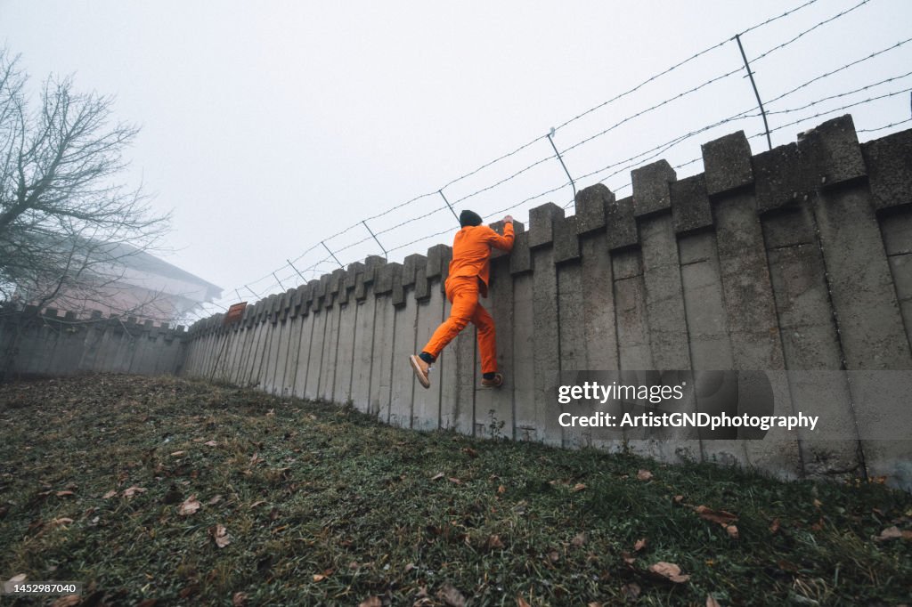Prisoner escaping from prison.