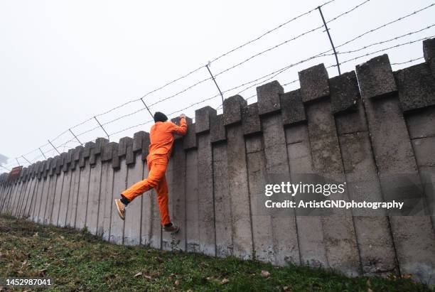 prisoner escaping from prison. - escaping stock pictures, royalty-free photos & images
