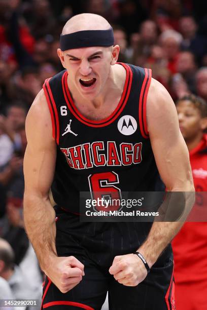 Alex Caruso of the Chicago Bulls celebrates a layup by Goran Dragic against the New Orleans Pelicans during the second half at United Center on...