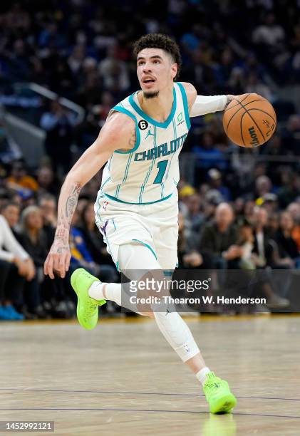 LaMelo Ball of the Charlotte Hornets dribbles the ball against the Golden State Warriors during the second quarter of an NBA basketball game at Chase...