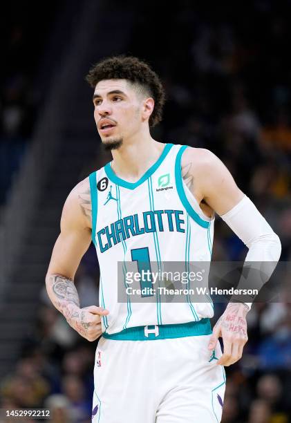 LaMelo Ball of the Charlotte Hornets looks on against the Golden State Warriors during the third quarter of an NBA basketball game at Chase Center on...