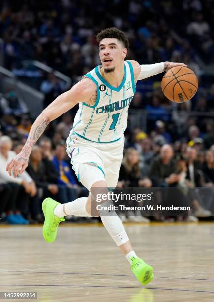 LaMelo Ball of the Charlotte Hornets dribbles the ball against the Golden State Warriors during the second quarter of an NBA basketball game at Chase...