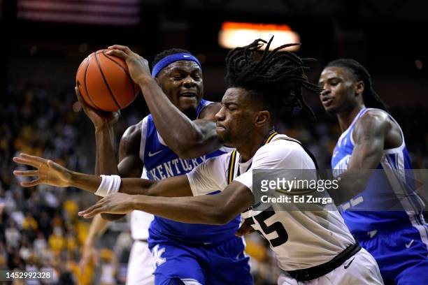 Oscar Tshiebwe of the Kentucky Wildcats drives to the basket against Sean East II of the Missouri Tigers in the first half at Mizzou Arena on...