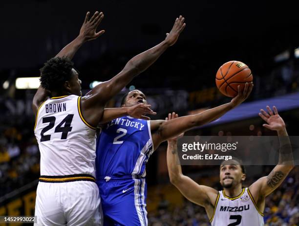Sahvir Wheeler of the Kentucky Wildcats lays the ball up against Kobe Brown of the Missouri Tigers in the first half at Mizzou Arena on December 28,...