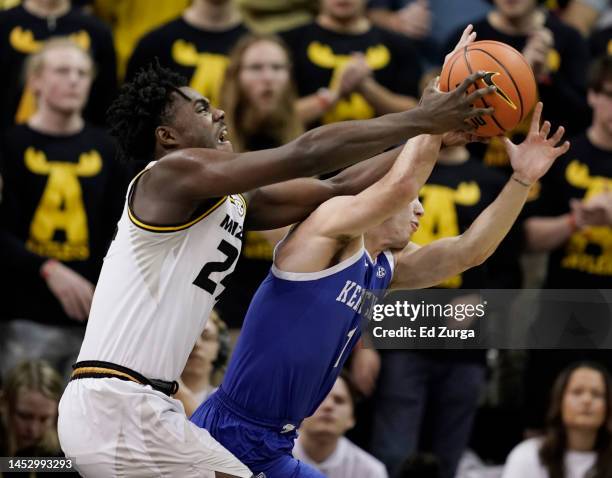 Kobe Brown of the Missouri Tigers tries to rebound the ball against CJ Fredrick of the Kentucky Wildcats in the first half at Mizzou Arena on...
