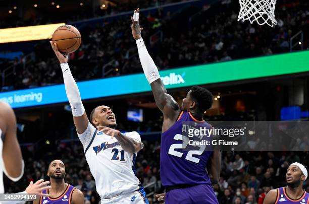 Daniel Gafford of the Washington Wizards shoots the ball in the second quarter against Deandre Ayton of the Phoenix Suns at Capital One Arena on...