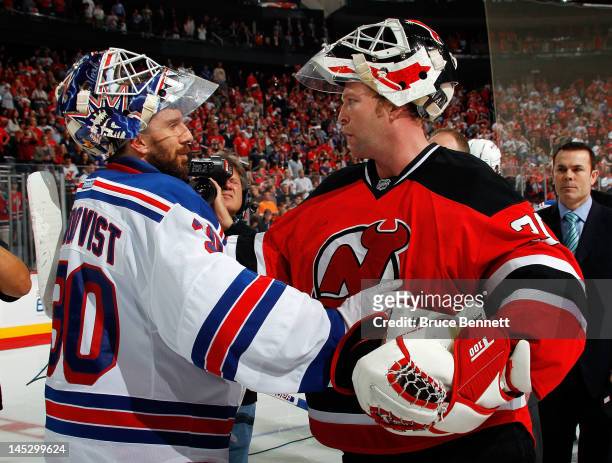 Martin Brodeur of the New Jersey Devils shakes hands with Henrik Lundqvist of the New York Rangers after the Devils defeating the Rangers by a score...
