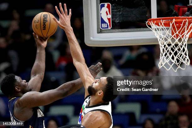 Zion Williamson of the New Orleans Pelicans shoots over Rudy Gobert of the Minnesota Timberwolves during the first quarter of an NBA game at Smoothie...