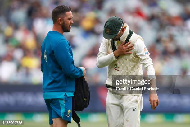 Nathan Lyon of Australia reacts after injuring his shoulder during day four of the Second Test match in the series between Australia and South Africa...