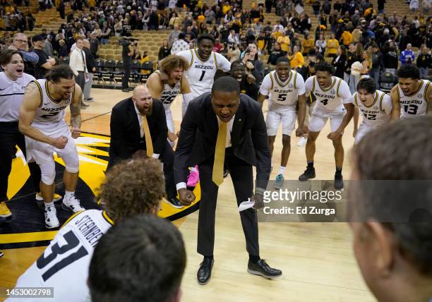 Head coach Dennis Gates of the Missouri Tigers celebrates with his team after a 89-75 win over the Kentucky Wildcats at Mizzou Arena on December 28,...