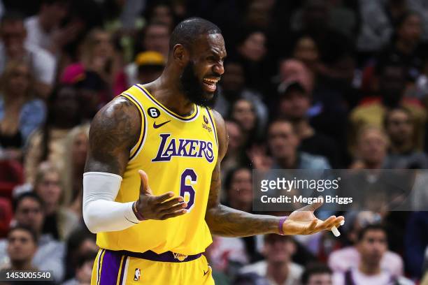 LeBron James of the Los Angeles Lakers reacts during the third quarter against the Miami Heat at FTX Arena on December 28, 2022 in Miami, Florida....