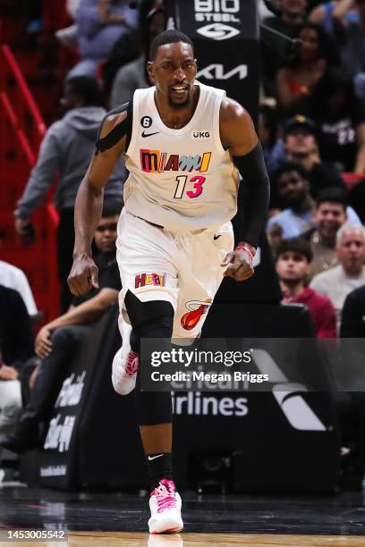 Bam Adebayo of the Miami Heat runs the floor after a dunk against the Los Angeles Lakers during the third quarter at FTX Arena on December 28, 2022...