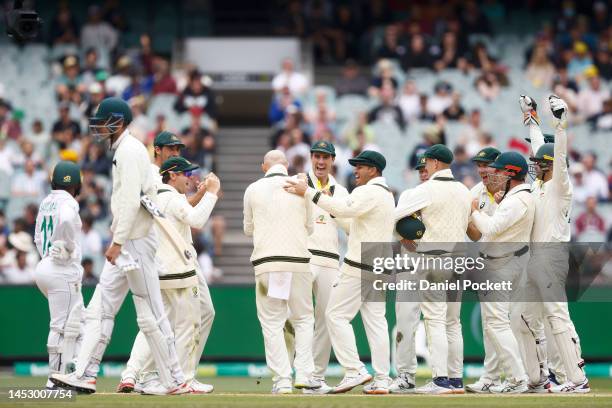 Nathan Lyon of Australia celebrates the dismissal of Marco Jansen of South Africa during day four of the Second Test match in the series between...