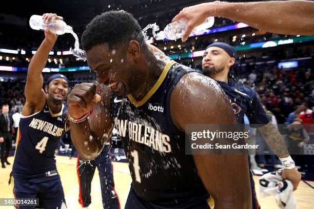 Zion Williamson of the New Orleans Pelicans is sprayed with water by teammates after scoring 43 points after an NBA game against the Minnesota...