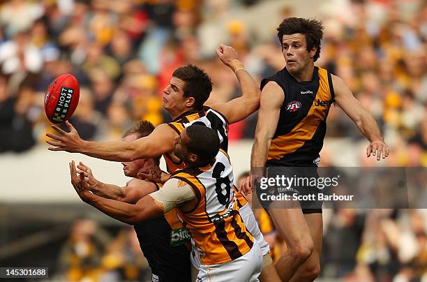 Ben Stratton and Josh Gibson of the Hawks compete for the ball during the round nine AFL match between the Richmond Tigers and the Hawthorn Hawks at...