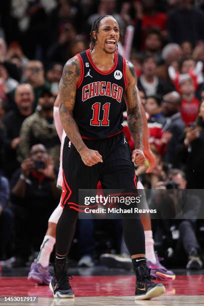 DeMar DeRozan of the Chicago Bulls celebrates a basket against the Milwaukee Bucks in overtime at United Center on December 28, 2022 in Chicago,...