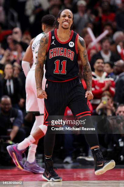 DeMar DeRozan of the Chicago Bulls celebrates a basket against the Milwaukee Bucks in overtime at United Center on December 28, 2022 in Chicago,...