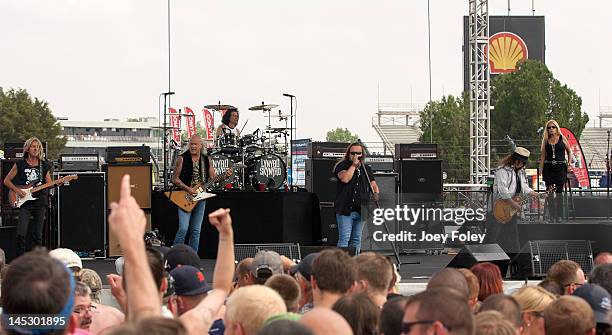 Mark Matejka, Rickey Medlocke, Michael Cartellone, Johnny Van Zant, Gary Rossington and Carol Chase of Lynyrd Skynyrd perform live during the 2012...