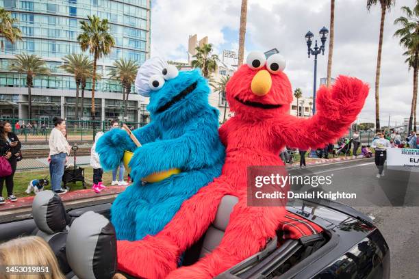 Sesame Street characters Cookie Monster and Elmo ride in the Port of San Diego Holiday Bowl Parade on December 28, 2022 in San Diego, California....