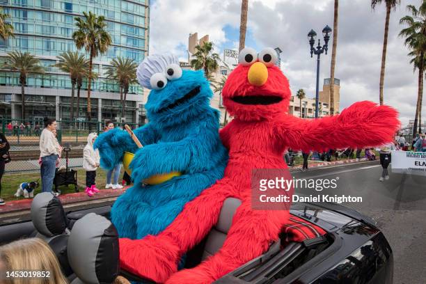 Sesame Street characters Cookie Monster and Elmo ride in the Port of San Diego Holiday Bowl Parade on December 28, 2022 in San Diego, California....
