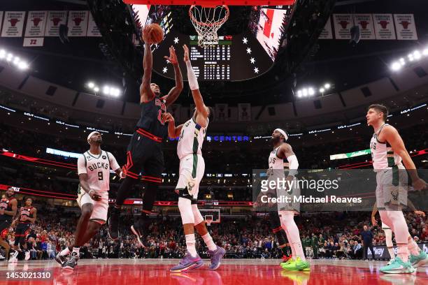 DeMar DeRozan of the Chicago Bulls goes up for a layup against Giannis Antetokounmpo of the Milwaukee Bucks during the second half at United Center...