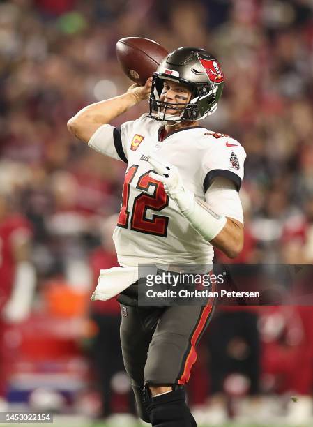 Quarterback Tom Brady of the Tampa Bay Buccaneers throws a pass during the NFL game at State Farm Stadium on December 25, 2022 in Glendale, Arizona....