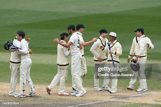 The Australian players celebrate winning the test during day four of the Second Test match in the series between Australia and South Africa at...