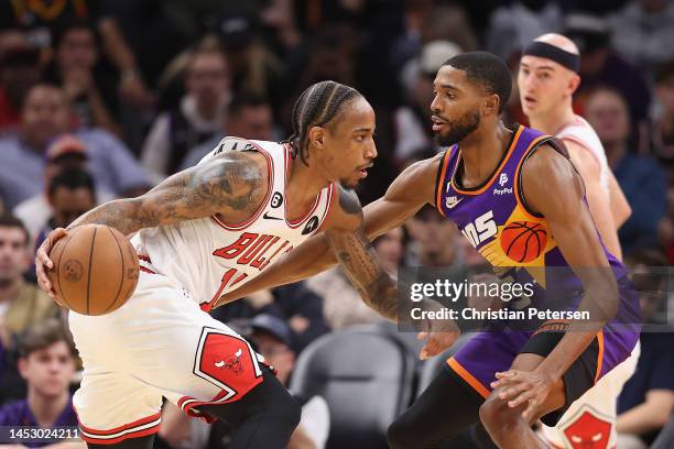 DeMar DeRozan of the Chicago Bulls handles the ball against Mikal Bridges of the Phoenix Suns during the first half of the NBA game at Footprint...