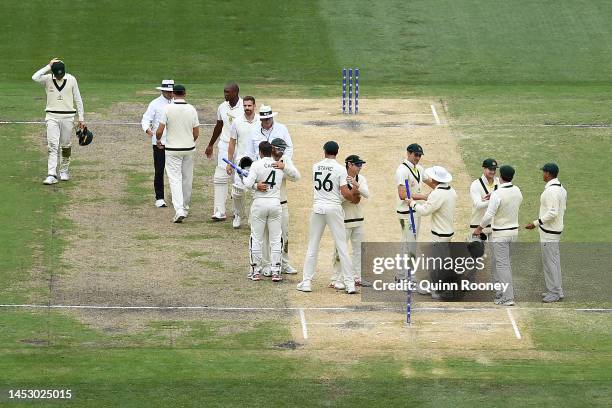 The Australian players celebrate winning the test during day four of the Second Test match in the series between Australia and South Africa at...