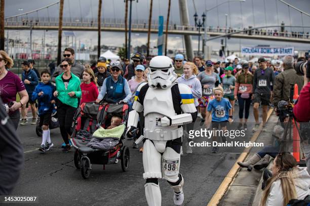 Runner in a Stormtrooper costume participates in the Holiday Bowl 5K on December 28, 2022 in San Diego, California. Billed as America's Largest...